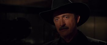 Movie still from “Last Man Standing” (1996), directed by Walter Hill – A person wearing a cowboy hat; Close Up shot, Over the shoulder angle
