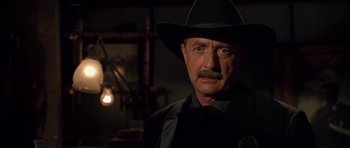 Movie still from “Last Man Standing” (1996), directed by Walter Hill – A person wearing a cowboy hat; Close Up shot, Low angle