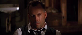 Movie still from “Last Man Standing” (1996), directed by Walter Hill – A person wearing a suit and tie; Close Up shot, Over the shoulder angle