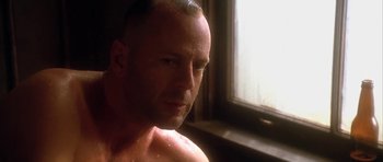 Movie still from “Last Man Standing” (1996), directed by Walter Hill – A person in a room near a window; Close Up shot, Low angle