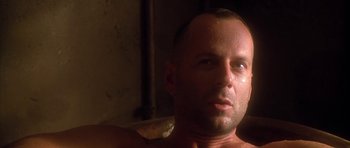 Movie still from “Last Man Standing” (1996), directed by Walter Hill – A man's face in the sunlight; Close Up shot, Low angle