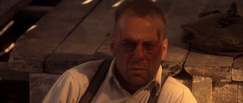 Movie still from “Last Man Standing” (1996), directed by Walter Hill – A person with blood on his face; Close Up shot, Low angle