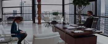 Movie still from “Fifty Shades of Grey” (2015), directed by Sam Taylor-Johnson – An office with a view of the city; Wide shot, High angle