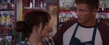 Movie still from “Fifty Shades of Grey” (2015), directed by Sam Taylor-Johnson – A man and a woman are talking in a store; Close Up shot, Over the shoulder angle