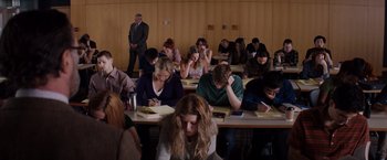 Movie still from “Fifty Shades of Grey” (2015), directed by Sam Taylor-Johnson – A group of people sitting at tables in a room; Wide shot, High angle