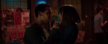 Movie still from “Fifty Shades of Grey” (2015), directed by Sam Taylor-Johnson – A man and a woman standing next to each other in the dark; Close Up shot, Over the shoulder angle