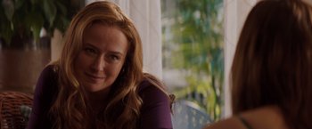 Movie still from “Fifty Shades of Grey” (2015), directed by Sam Taylor-Johnson – A person sitting on a chair; Close Up shot, Over the shoulder angle