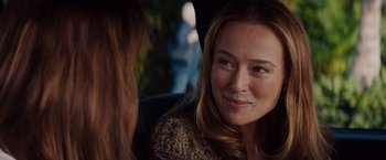 Movie still from “Fifty Shades of Grey” (2015), directed by Sam Taylor-Johnson – A person sitting in a chair; Close Up shot, Over the shoulder angle