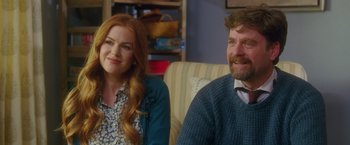 Movie still from “Keeping Up with the Joneses” (2016), directed by Greg Mottola – A man and a woman sitting in a living room together; Medium shot, Over the shoulder angle