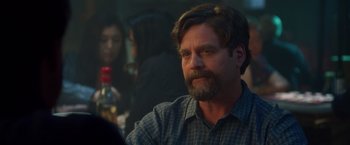 Movie still from “Keeping Up with the Joneses” (2016), directed by Greg Mottola – A person sitting at a table; Close Up shot, Over the shoulder angle