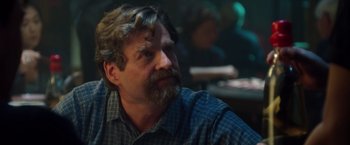 Movie still from “Keeping Up with the Joneses” (2016), directed by Greg Mottola – A person sitting in a room; Close Up shot, Over the shoulder angle