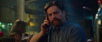 Movie still from “Keeping Up with the Joneses” (2016), directed by Greg Mottola – A person talking on a cell phone; Close Up shot, Low angle