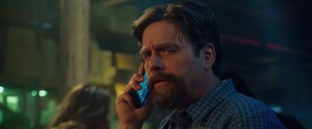 Movie still from “Keeping Up with the Joneses” (2016), directed by Greg Mottola – A person talking on a cell phone; Close Up shot, Low angle