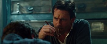 Movie still from “Keeping Up with the Joneses” (2016), directed by Greg Mottola – A person smoking a cigarette; Close Up shot, Over the shoulder angle