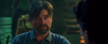 Movie still from “Keeping Up with the Joneses” (2016), directed by Greg Mottola – A person with a beard; Close Up shot, Over the shoulder angle