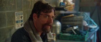 Movie still from “Keeping Up with the Joneses” (2016), directed by Greg Mottola – A person with a beard; Close Up shot, Over the shoulder angle