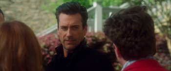 Movie still from “Keeping Up with the Joneses” (2016), directed by Greg Mottola – A person wearing a black shirt; Close Up shot, Over the shoulder angle