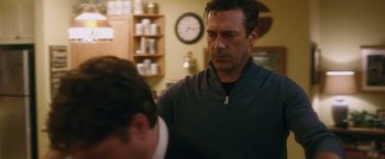 Movie still from “Keeping Up with the Joneses” (2016), directed by Greg Mottola – A person standing in a room; Medium shot, Over the shoulder angle