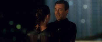 Movie still from “Keeping Up with the Joneses” (2016), directed by Greg Mottola – A man and a woman standing next to each other in front of lights; Close Up shot, Over the shoulder angle