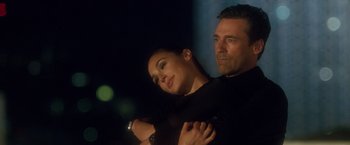 Movie still from “Keeping Up with the Joneses” (2016), directed by Greg Mottola – A man and a woman are posing for a picture; Close Up shot, Low angle