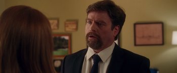 Movie still from “Keeping Up with the Joneses” (2016), directed by Greg Mottola – A man in a suit and tie looking at a woman; Close Up shot, Over the shoulder angle