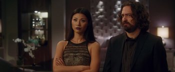 Movie still from “Keeping Up with the Joneses” (2016), directed by Greg Mottola – A woman standing next to a man in front of a mirror; Close Up shot, Low angle