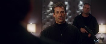 Movie still from “Keeping Up with the Joneses” (2016), directed by Greg Mottola – A person wearing a black jacket; Close Up shot, Over the shoulder angle