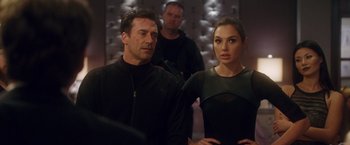 Movie still from “Keeping Up with the Joneses” (2016), directed by Greg Mottola – A man and a woman standing next to each other; Medium shot, Over the shoulder angle