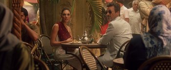 Movie still from “Keeping Up with the Joneses” (2016), directed by Greg Mottola – A man and a woman sitting at a table; Medium shot, Over the shoulder angle
