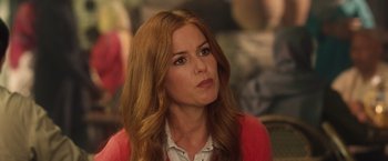 Movie still from “Keeping Up with the Joneses” (2016), directed by Greg Mottola – A person with long red hair; Close Up shot, Over the shoulder angle