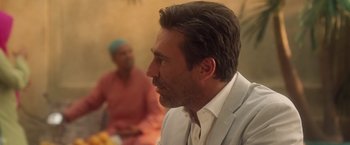 Movie still from “Keeping Up with the Joneses” (2016), directed by Greg Mottola – A person wearing a suit; Close Up shot, Over the shoulder angle