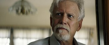 Movie still from “The Last Rampage” (2017), directed by Dwight H. Little – An older man with white hair and a white beard; Close Up shot, Low angle