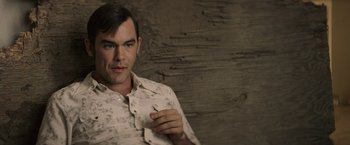 Movie still from “The Last Rampage” (2017), directed by Dwight H. Little – A man in a white shirt is holding a cigarette; Close Up shot, High angle