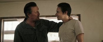 Movie still from “The Last Rampage” (2017), directed by Dwight H. Little – A man standing next to a young man in front of a window; Close Up shot, Over the shoulder angle