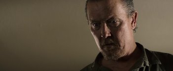 Movie still from “The Last Rampage” (2017), directed by Dwight H. Little – A person looking at the camera; Close Up shot, Over the shoulder angle