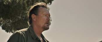 Movie still from “The Last Rampage” (2017), directed by Dwight H. Little – A person wearing a shirt; Close Up shot, Low angle
