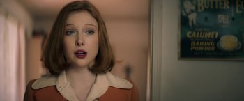 Movie still from “The Last Rampage” (2017), directed by Dwight H. Little – A young woman with red hair and blue eyes looking at the camera; Close Up shot, Over the shoulder angle