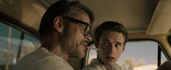 Movie still from “The Last Rampage” (2017), directed by Dwight H. Little – A man and a boy are looking at each other in a car; Close Up shot, Over the shoulder angle