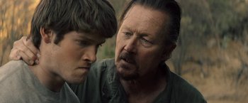 Movie still from “The Last Rampage” (2017), directed by Dwight H. Little – A man and a young boy looking at each other; Close Up shot, Over the shoulder angle