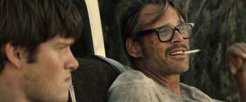 Movie still from “The Last Rampage” (2017), directed by Dwight H. Little – An older man wearing glasses sitting next to a younger man; Close Up shot, Over the shoulder angle