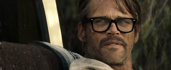 Movie still from “The Last Rampage” (2017), directed by Dwight H. Little – A person wearing glasses; Close Up shot, Over the shoulder angle
