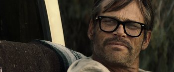 Movie still from “The Last Rampage” (2017), directed by Dwight H. Little – A person wearing glasses; Close Up shot, Low angle