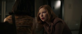 Movie still from “The Last Rampage” (2017), directed by Dwight H. Little – A red headed woman looking up at a person; Close Up shot, Over the shoulder angle