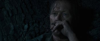 Movie still from “The Last Rampage” (2017), directed by Dwight H. Little – A person holding his hand up to his face; Close Up shot, Over the shoulder angle
