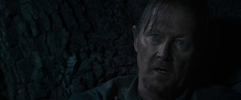 Movie still from “The Last Rampage” (2017), directed by Dwight H. Little – A person wearing a green shirt; Close Up shot, Over the shoulder angle