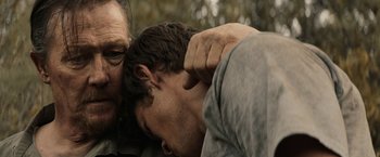 Movie still from “The Last Rampage” (2017), directed by Dwight H. Little – A man and a man with their hands on each other's shoulders; Close Up shot, Over the shoulder angle