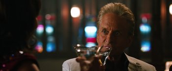 Movie still from “Last Vegas” (2013), directed by Jon Turteltaub – A person holding a wine glass; Close Up shot, Over the shoulder angle