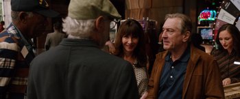 Movie still from “Last Vegas” (2013), directed by Jon Turteltaub – A woman and two men are talking to each other; Medium shot, Over the shoulder angle