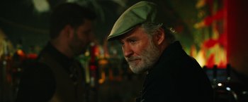 Movie still from “Last Vegas” (2013), directed by Jon Turteltaub – An older man wearing a green hat looking to his left; Close Up shot, Over the shoulder angle