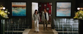 Movie still from “Last Vegas” (2013), directed by Jon Turteltaub – A man and a woman are walking through a room; Wide shot, Over the shoulder angle